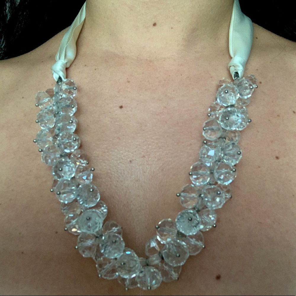 Gorgeous crystal statement necklace with crystal beads and cream ribbon tie.